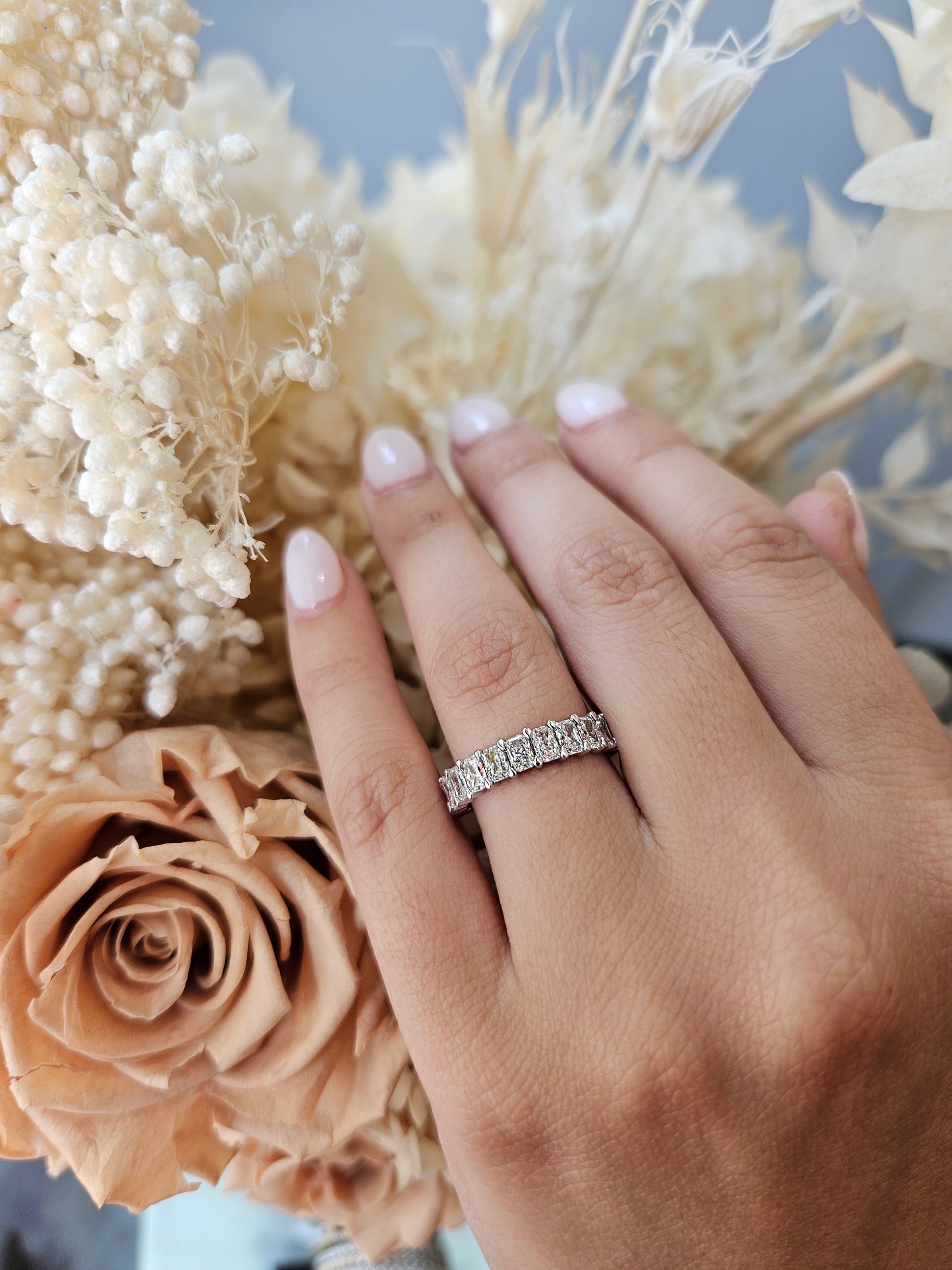 Close-up of Demi wedding ring with diamond accents